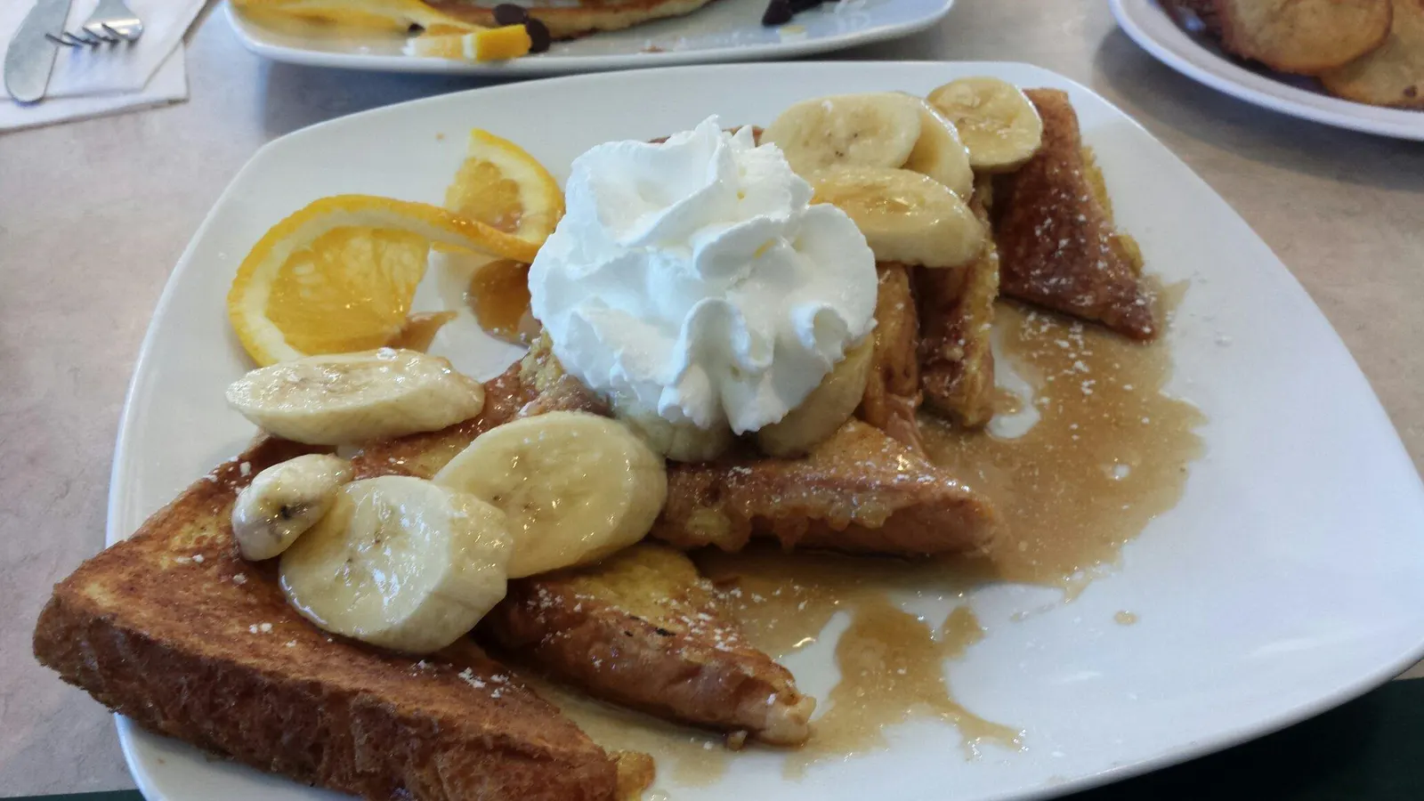 French toast with bananas and whipped cream